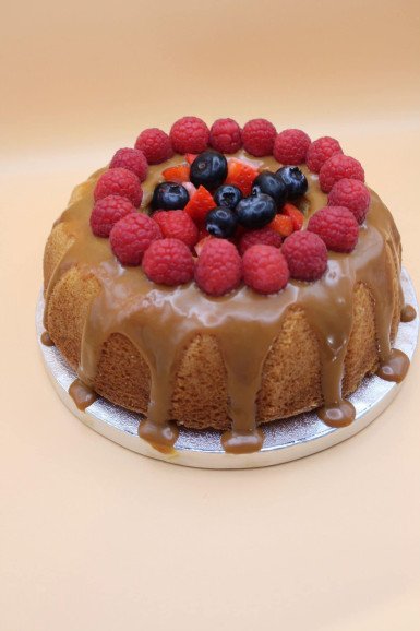 Bundt cake topped with caramel and fruit - a choice of flavour and design