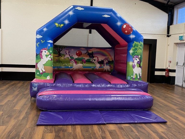 A classic unicorn bouncy castle is great for unicorn themed parties