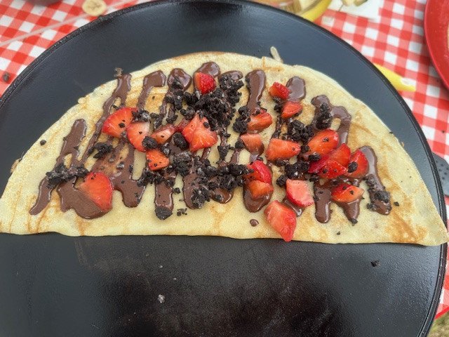 Crepe with chocolate, crunchy Oreo and strawberries