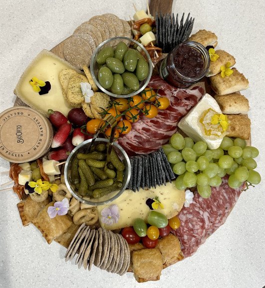 Adults grazing charcuterie platter