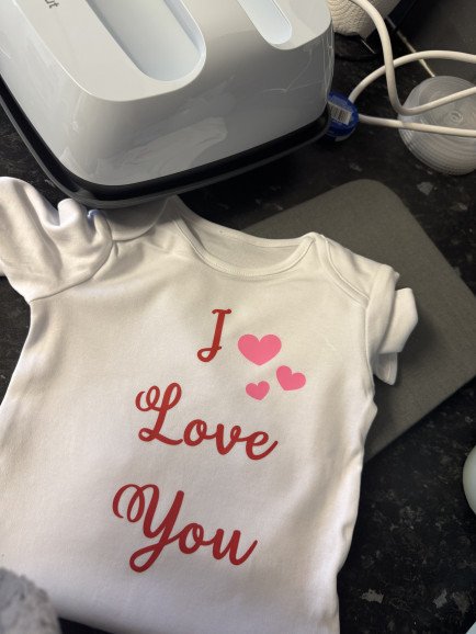 Personalised Valentine’s Day vest. 
These are available from newborn - 12-18 months in vests, onwards - XXXL in T-shirts. Can be personalised with any design x