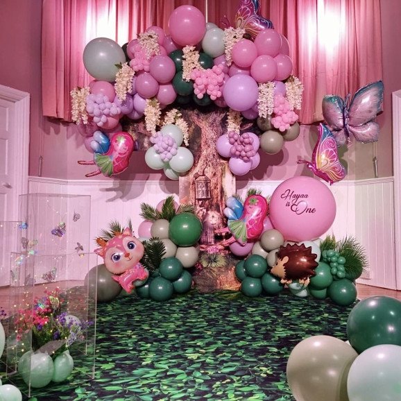 Create a stunning balloon decoration for an enchanting forest or fairy-themed birthday party.